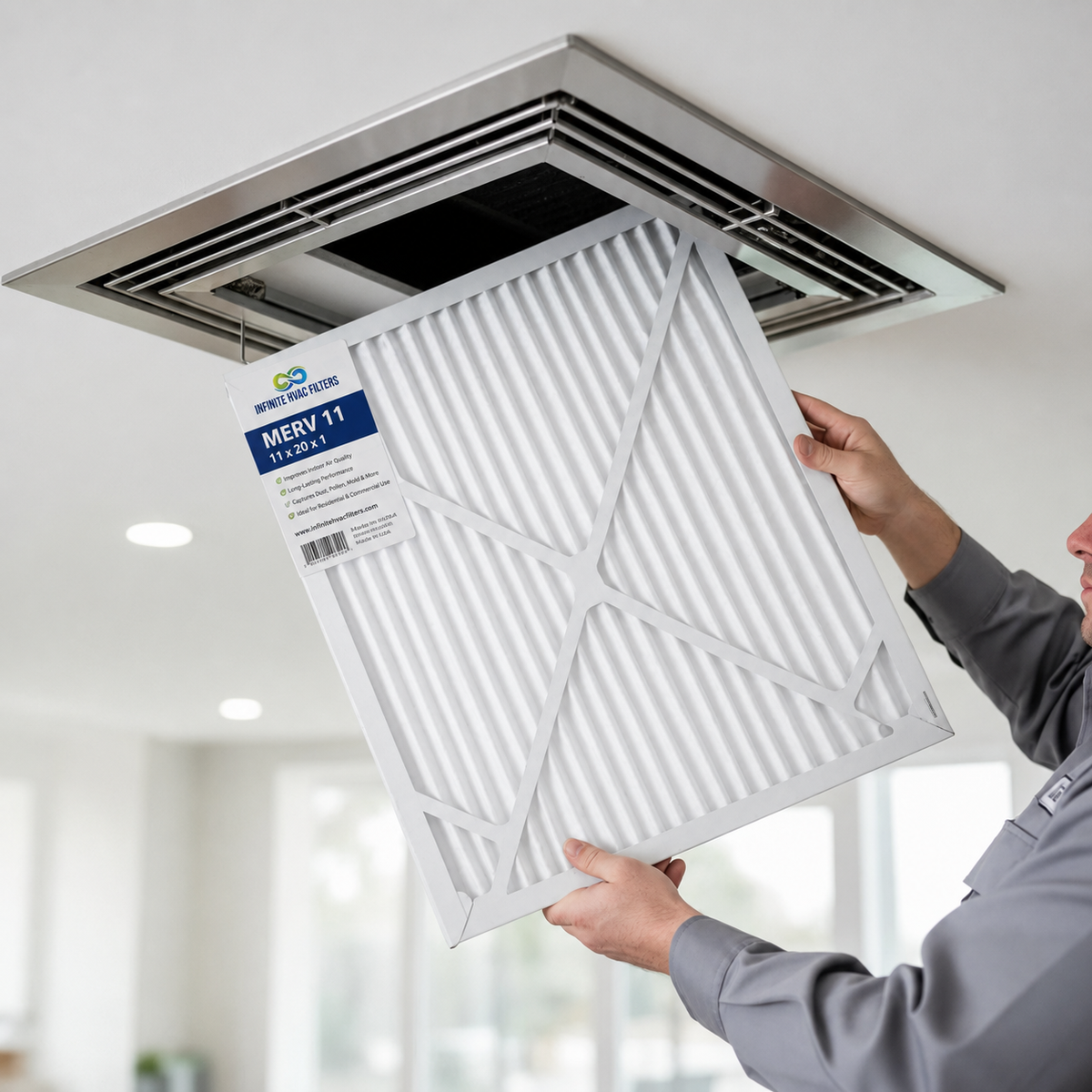 Air filter being installed into ceiling HVAC return